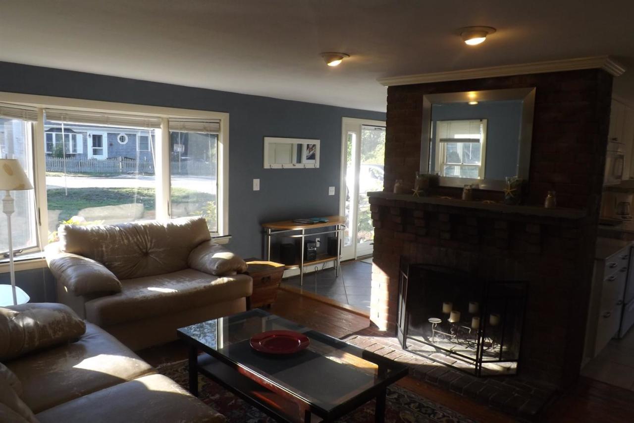 25 Doane Road Harwich Port, MA 02646 - Photo 11 of 18 a living room with furniture and a fireplace