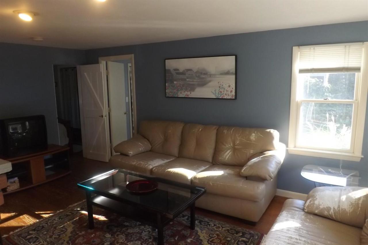 25 Doane Road Harwich Port, MA 02646 - Photo 12 of 18 a living room with furniture and a flat screen tv