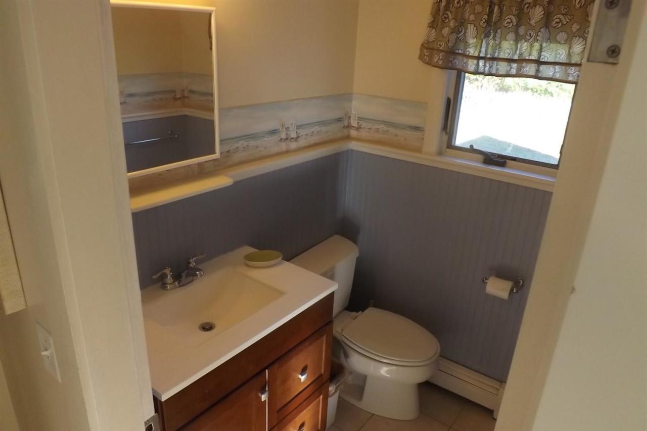 25 Doane Road Harwich Port, MA 02646 - Photo 14 of 18 a bathroom with a toilet and a sink