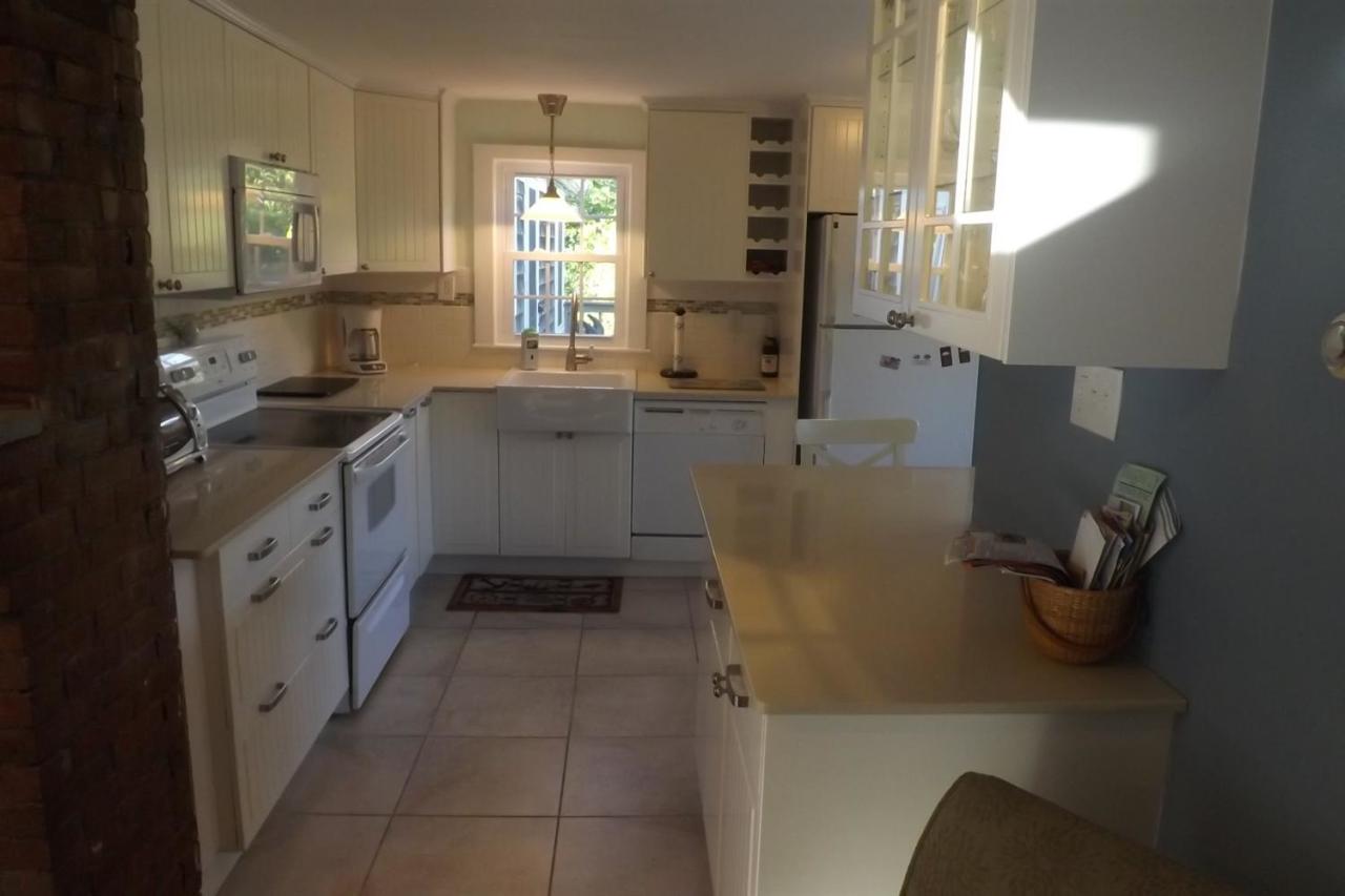 25 Doane Road Harwich Port, MA 02646 - Photo 5 of 18 a kitchen with a sink a window and stainless steel appliances
