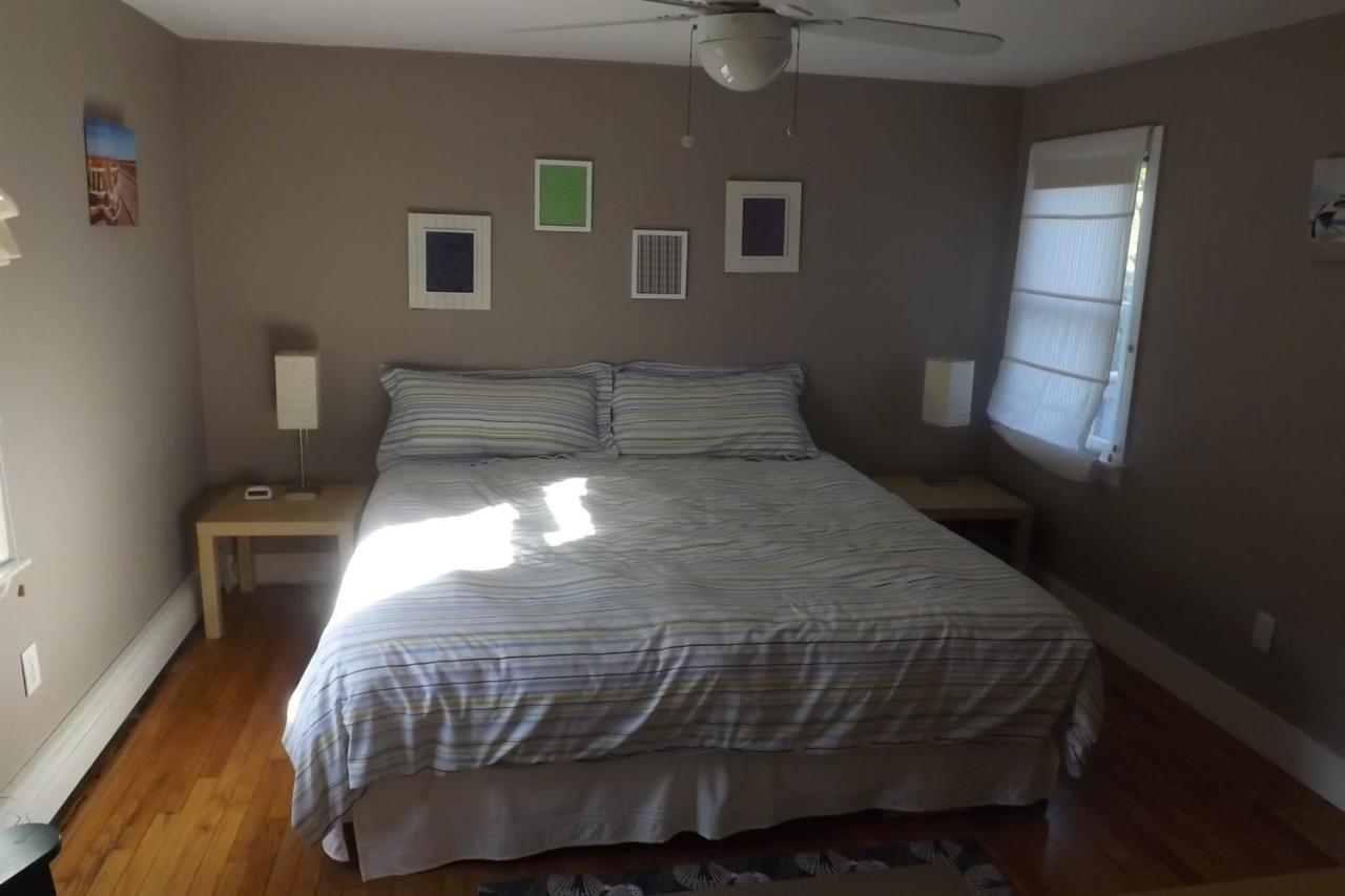 25 Doane Road Harwich Port, MA 02646 - Photo 8 of 18 a bedroom with a bed and a window
