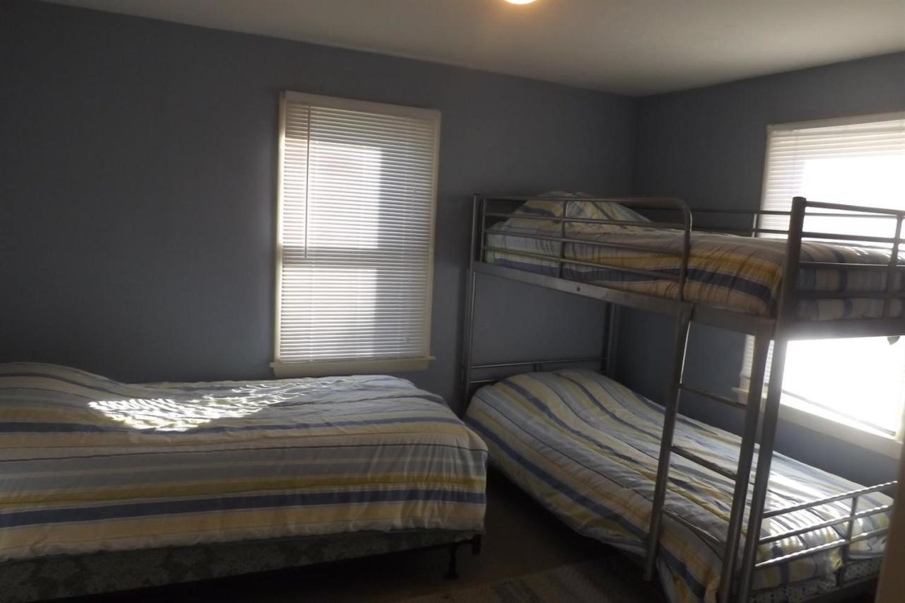 25 Doane Road Harwich Port, MA 02646 - Photo 9 of 18 a bedroom with a bed and window