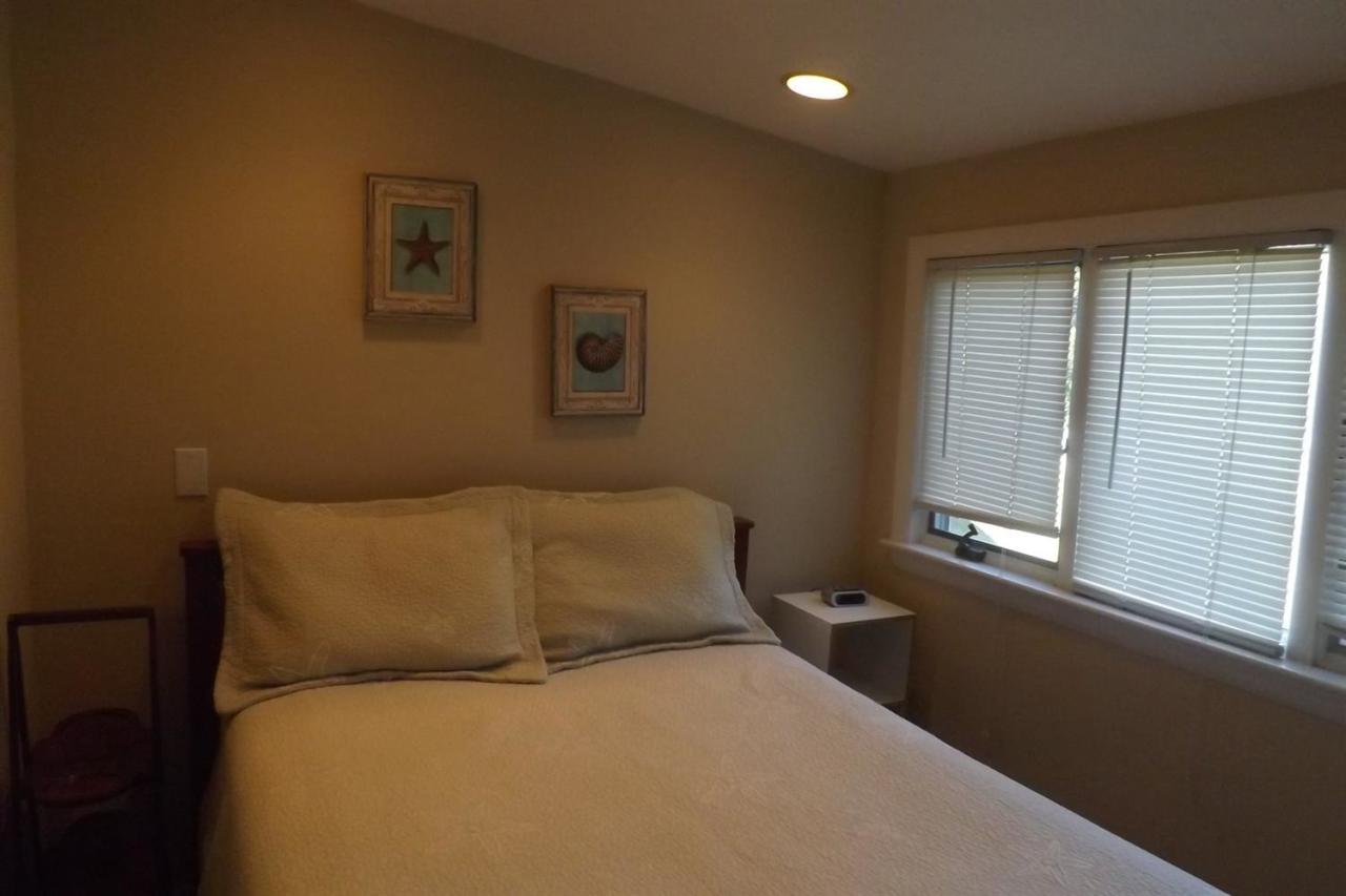 25 Doane Road Harwich Port, MA 02646 - Photo 10 of 18 a bed sitting in a bedroom next to a window