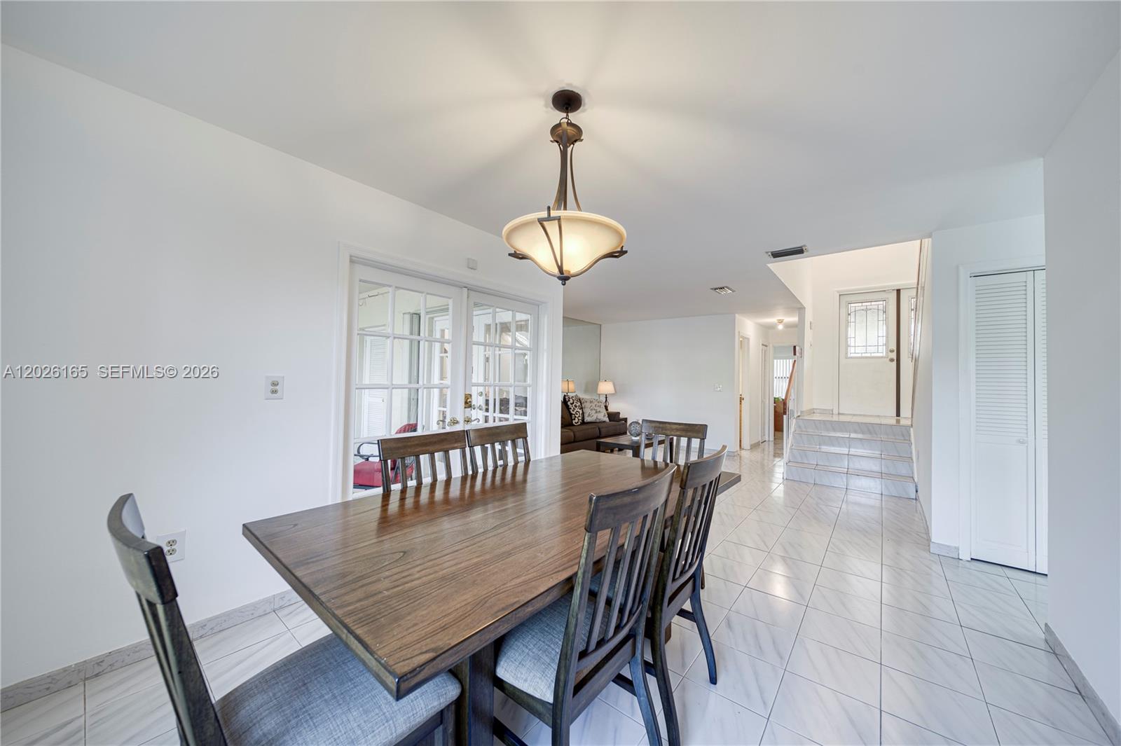 13337 Southwest 64th Lane Miami, FL 33183 - Photo 9 of 36 a view of a dining room with furniture window and wooden floor