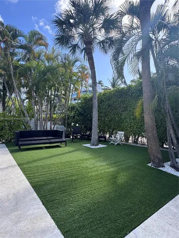 a view of a park with large trees