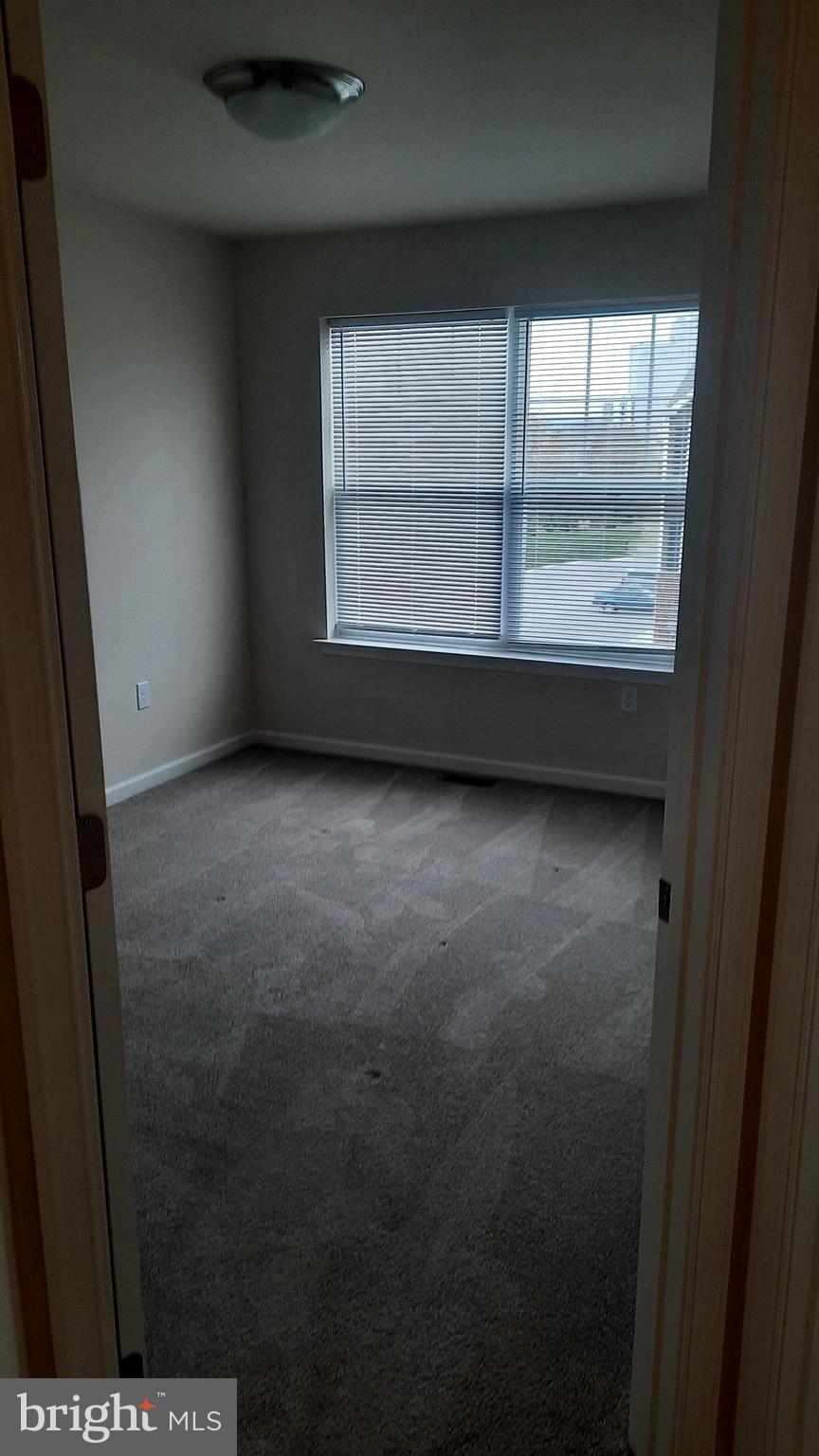 945 Admiral's Quay Drive Mechanicsburg, PA 17050 - Photo 12 of 15 a view of an empty room with a window