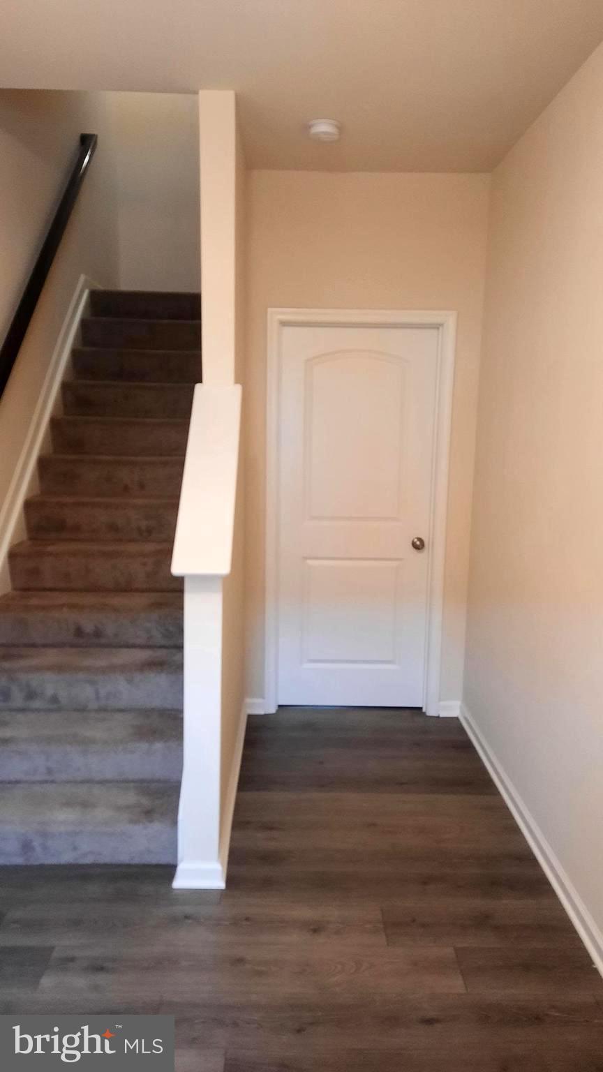 945 Admiral's Quay Drive Mechanicsburg, PA 17050 - Photo 3 of 15 a view of wooden floor and staircase in a room