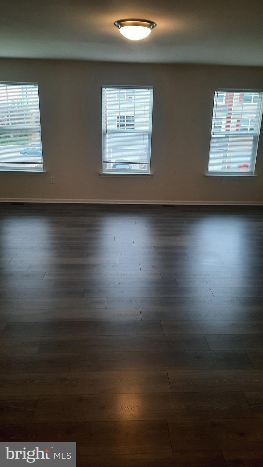 945 Admiral's Quay Drive Mechanicsburg, PA 17050 - Photo 7 of 15 a view of room and hall with wooden floor