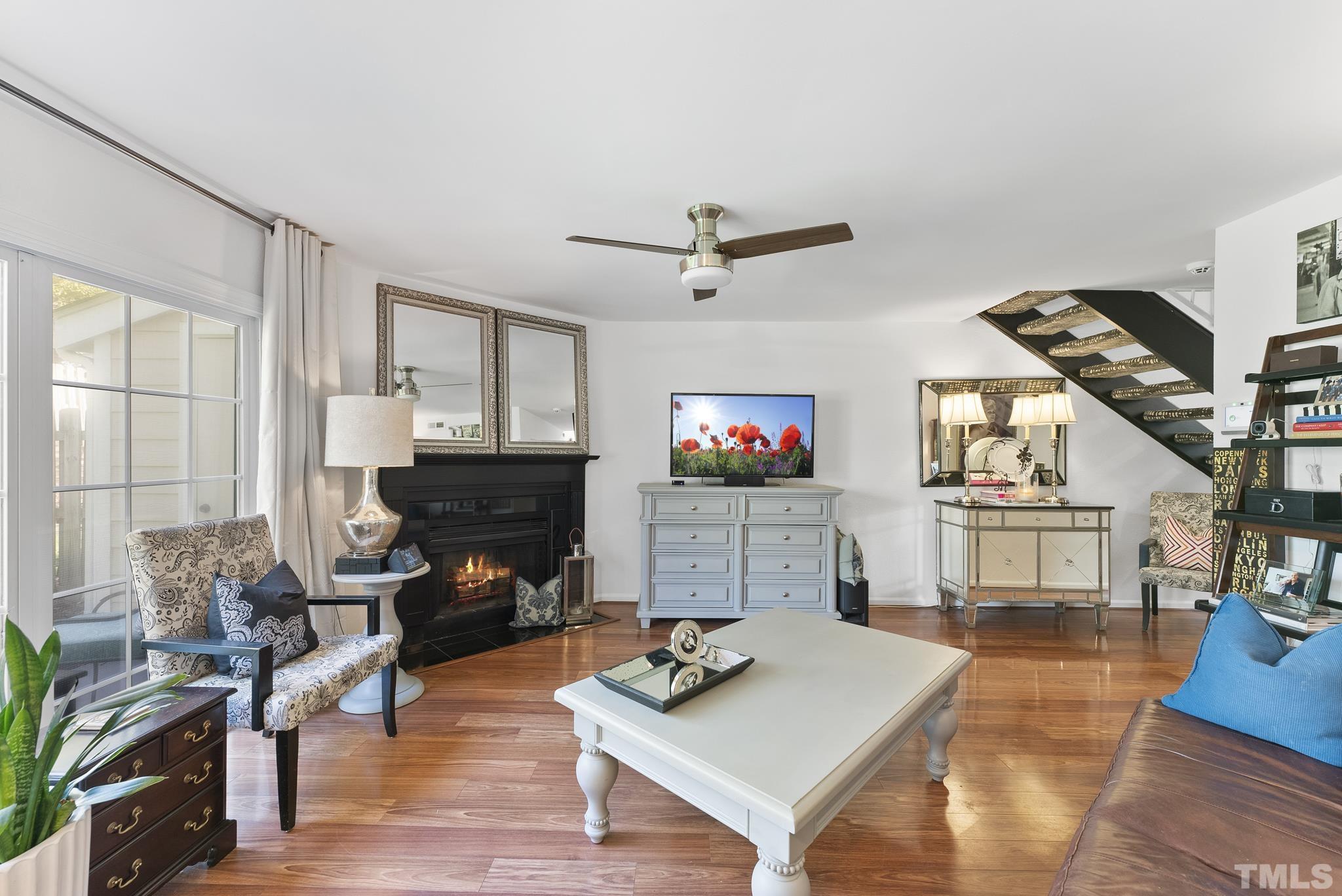 2408 Condor Court, Unit UN2408 Raleigh, NC 27615 - Photo 16 of 39 a living room with furniture and a flat screen tv