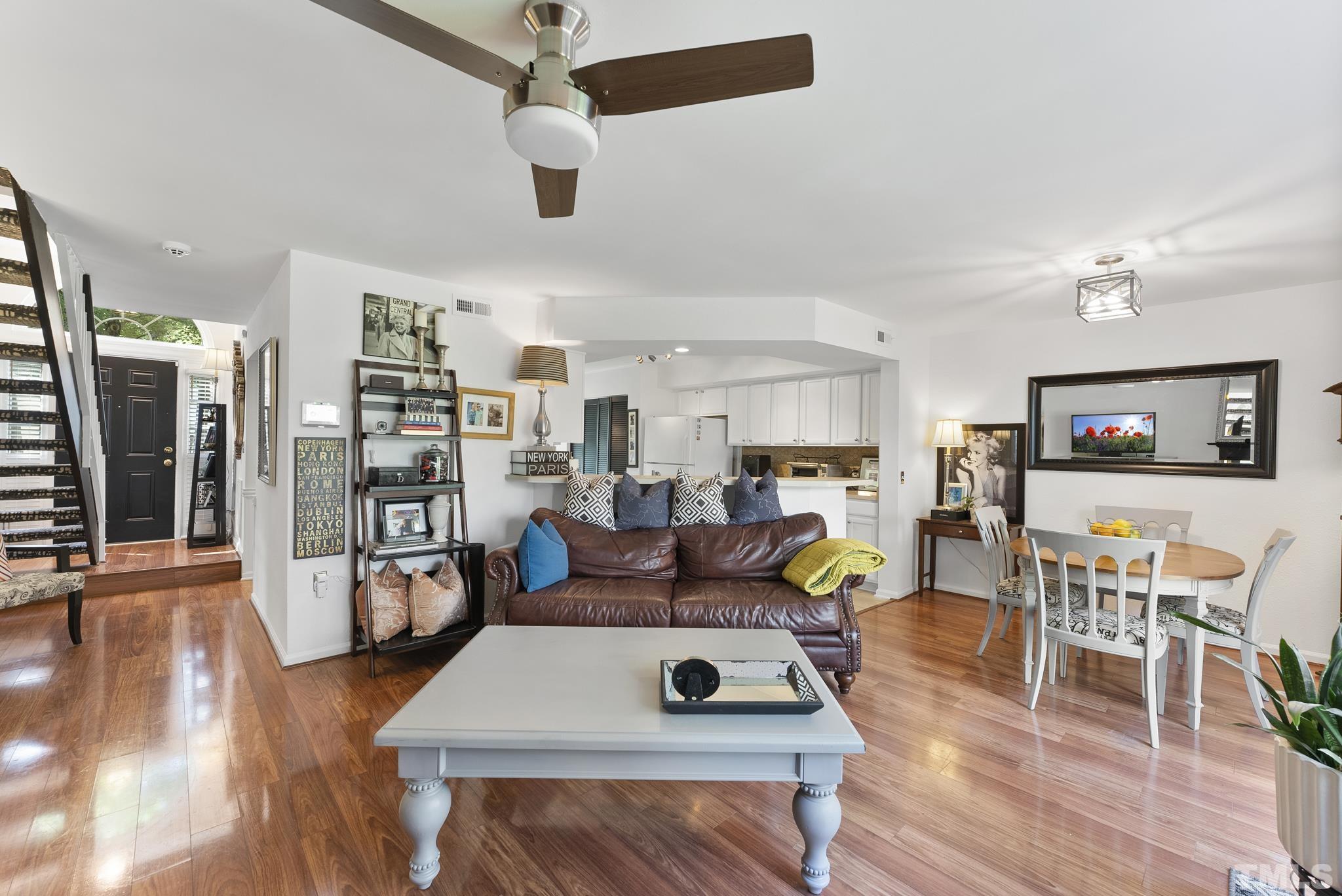 2408 Condor Court, Unit UN2408 Raleigh, NC 27615 - Photo 19 of 39 a living room with furniture and wooden floor
