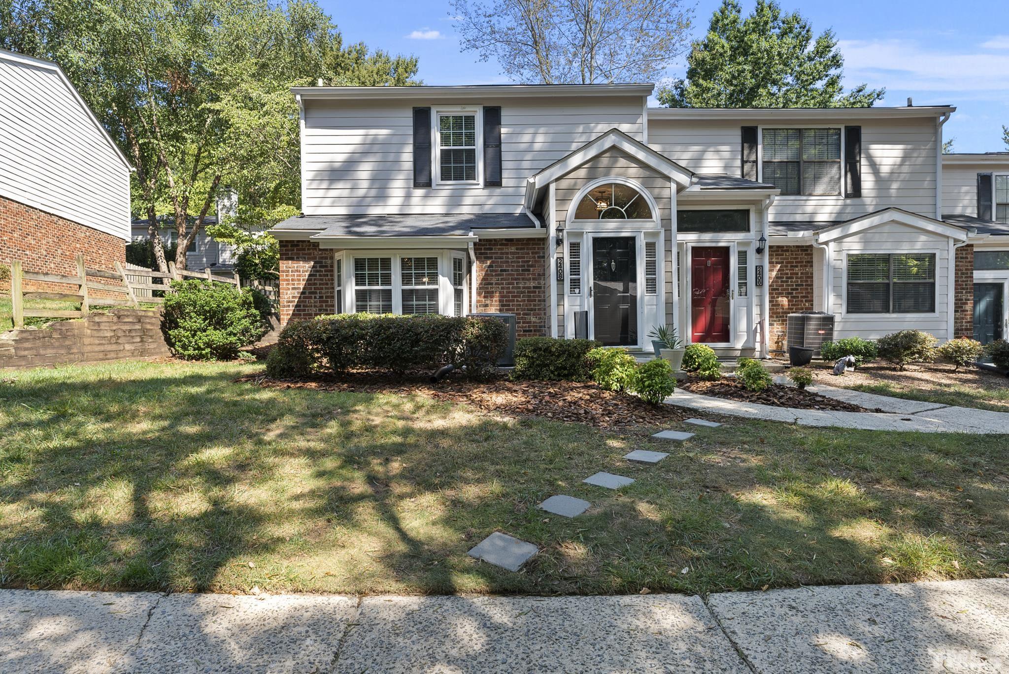2408 Condor Court, Unit UN2408 Raleigh, NC 27615 - Photo 2 of 39 a front view of a house with garden