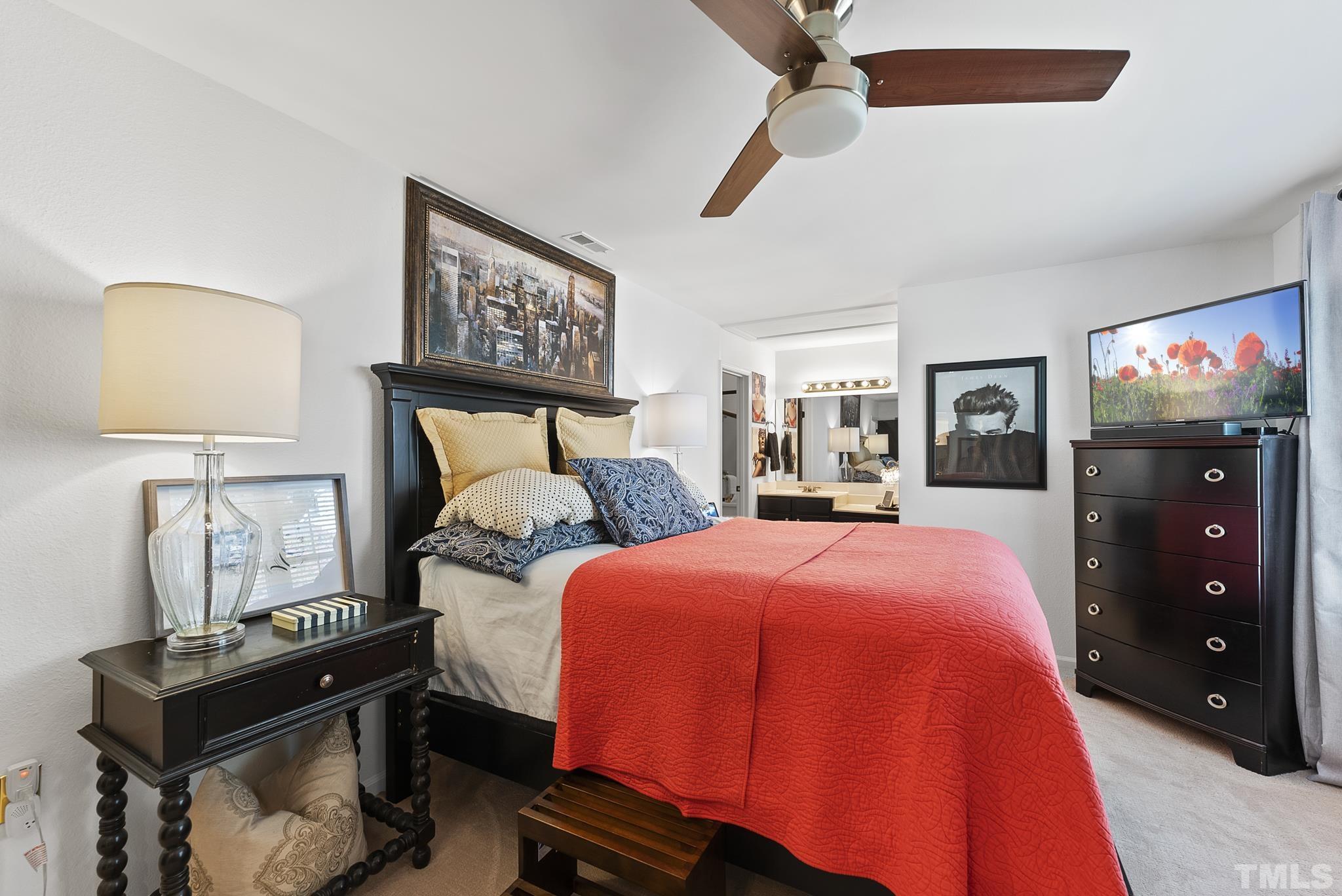 2408 Condor Court, Unit UN2408 Raleigh, NC 27615 - Photo 22 of 39 a bedroom with a bed and wooden floor
