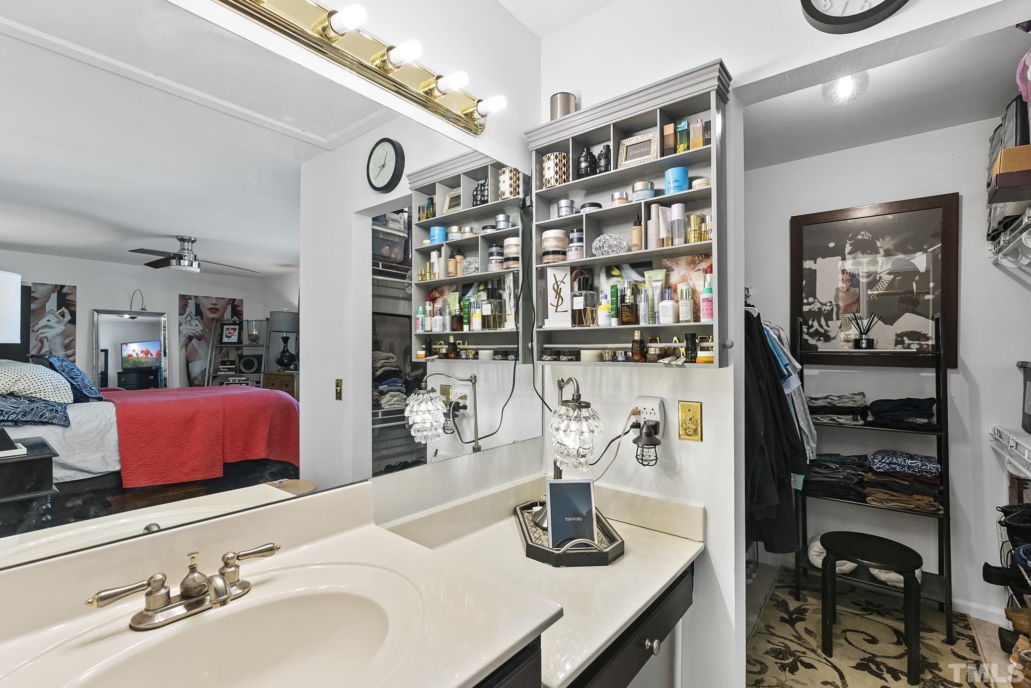 2408 Condor Court, Unit UN2408 Raleigh, NC 27615 - Photo 25 of 39 a bathroom with a sink and a mirror