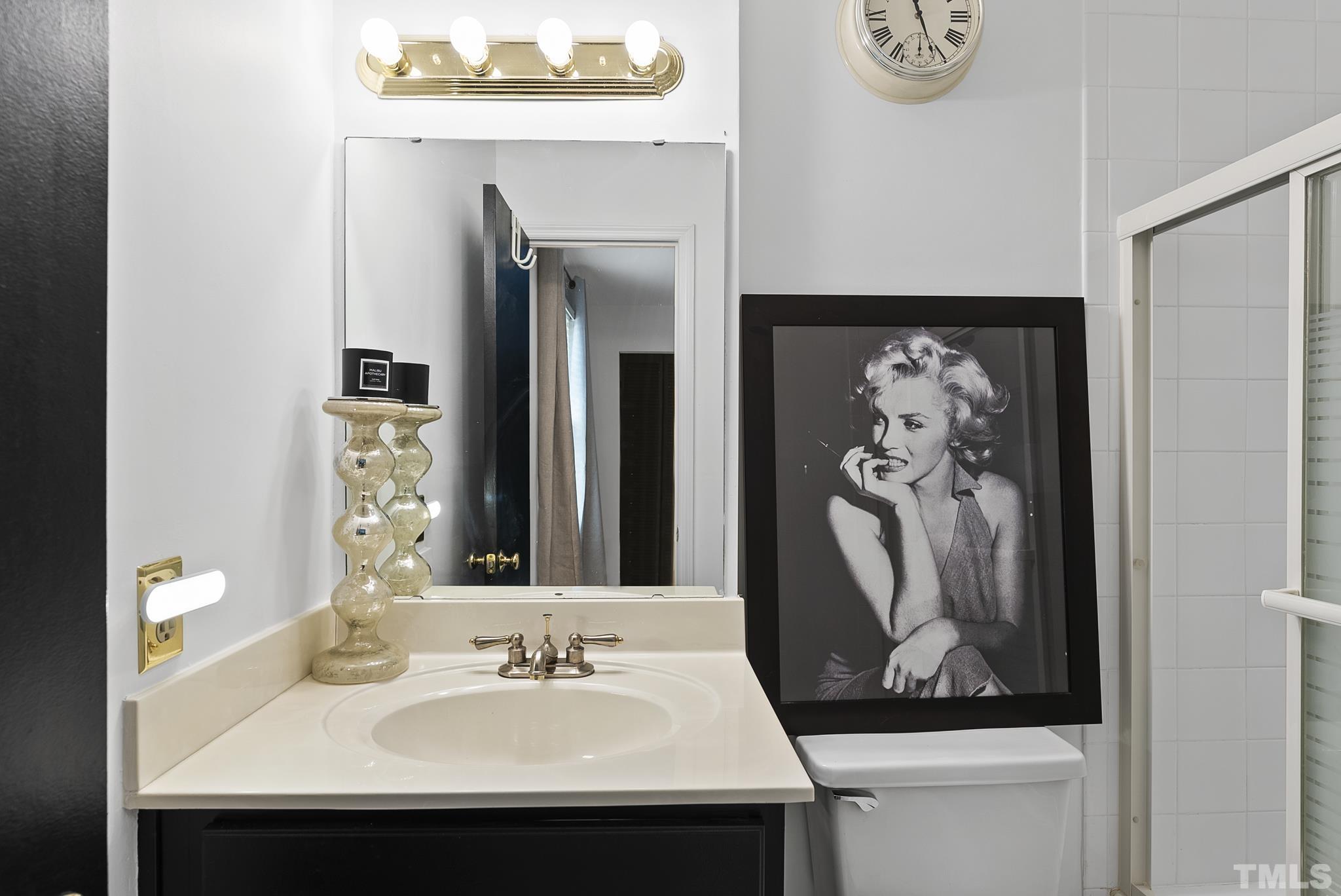 2408 Condor Court, Unit UN2408 Raleigh, NC 27615 - Photo 29 of 39 a bathroom with a sink and a mirror