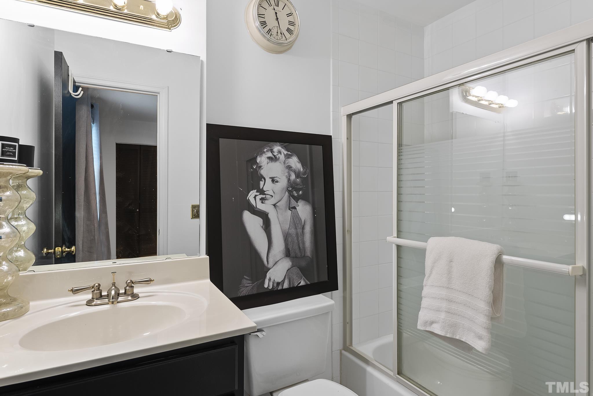 2408 Condor Court, Unit UN2408 Raleigh, NC 27615 - Photo 30 of 39 a bathroom with a sink and a mirror