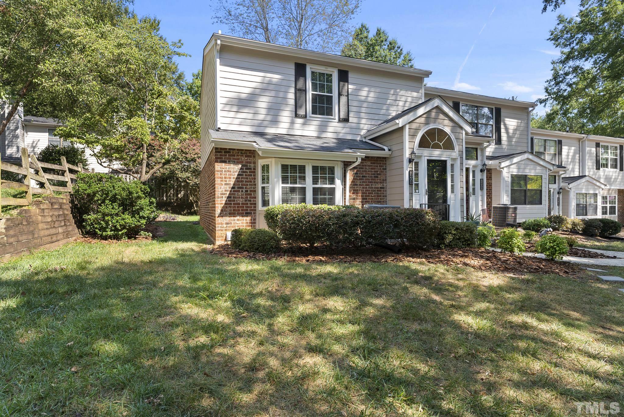 2408 Condor Court, Unit UN2408 Raleigh, NC 27615 - Photo 3 of 39 a front view of a house with a yard