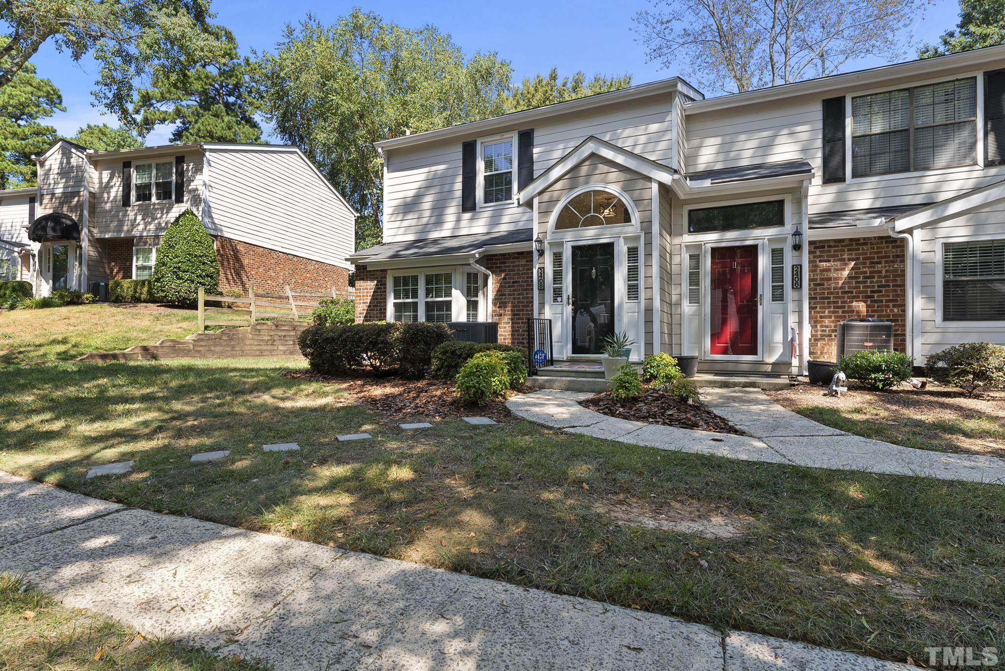 2408 Condor Court, Unit UN2408 Raleigh, NC 27615 - Photo 39 of 39 a front view of a house with a yard
