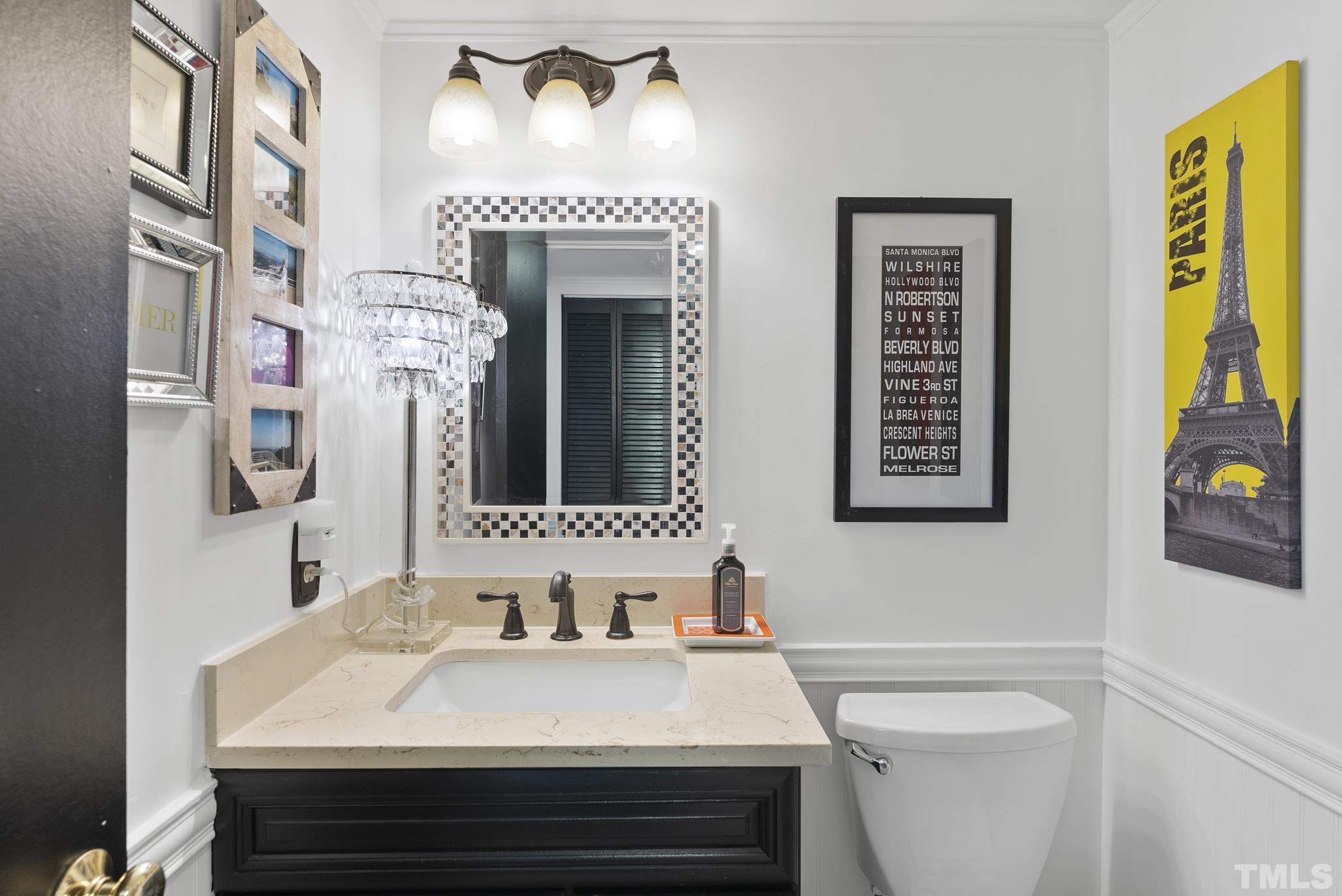 2408 Condor Court, Unit UN2408 Raleigh, NC 27615 - Photo 6 of 39 a bathroom with a sink and a mirror
