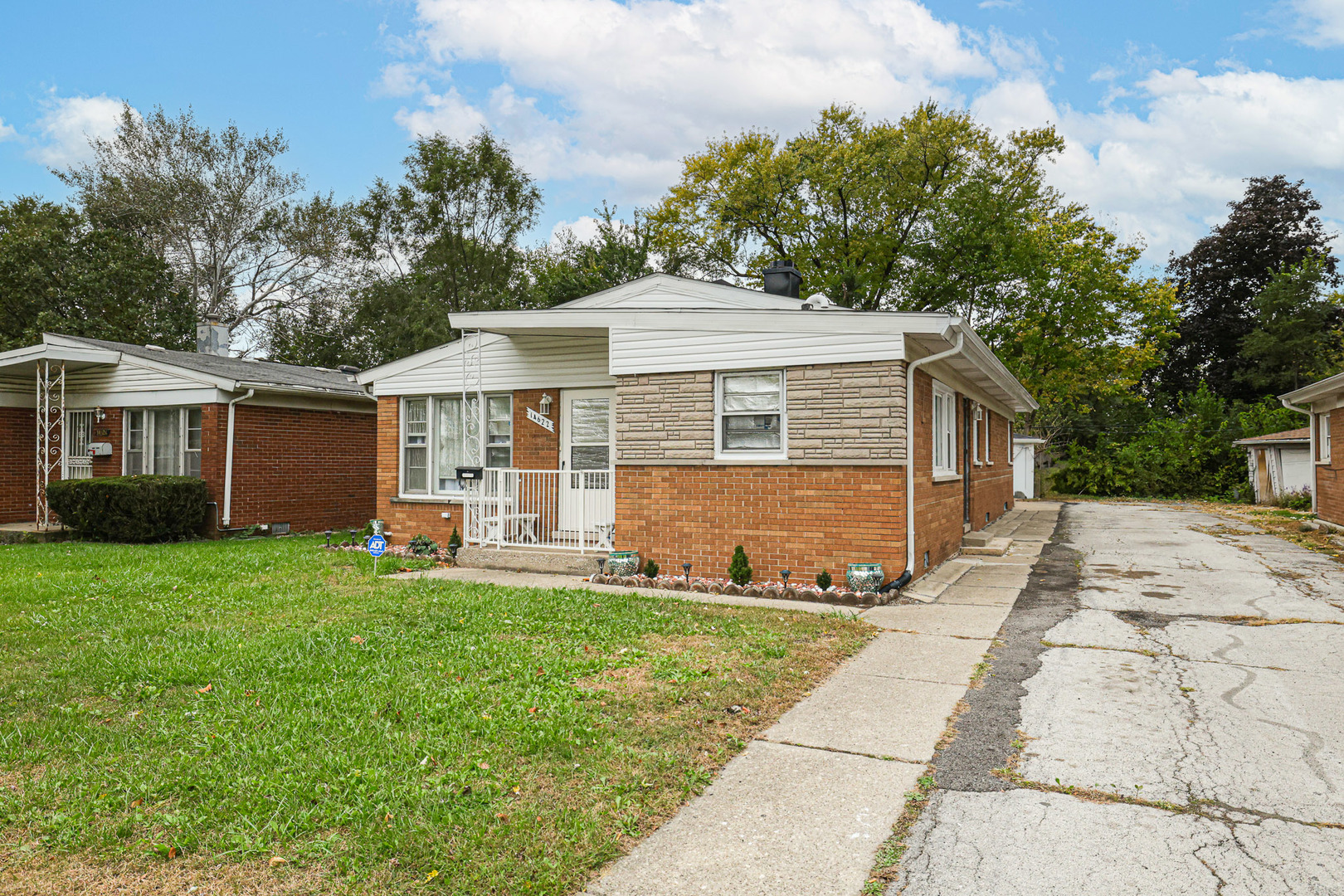 14622 Wabash Avenue Dolton, IL 60419 - Photo 2 of 18 a front view of house with yard and green space