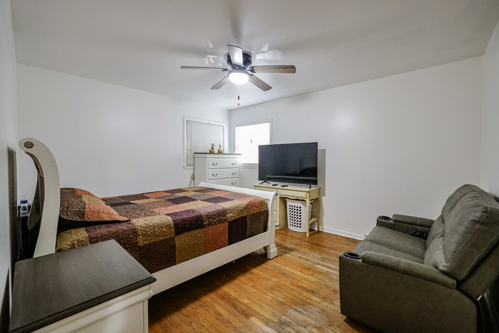 14622 Wabash Avenue Dolton, IL 60419 - Photo 5 of 18 a bedroom with a bed and a flat screen tv