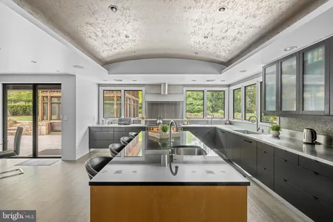 a dining table with chairs and window