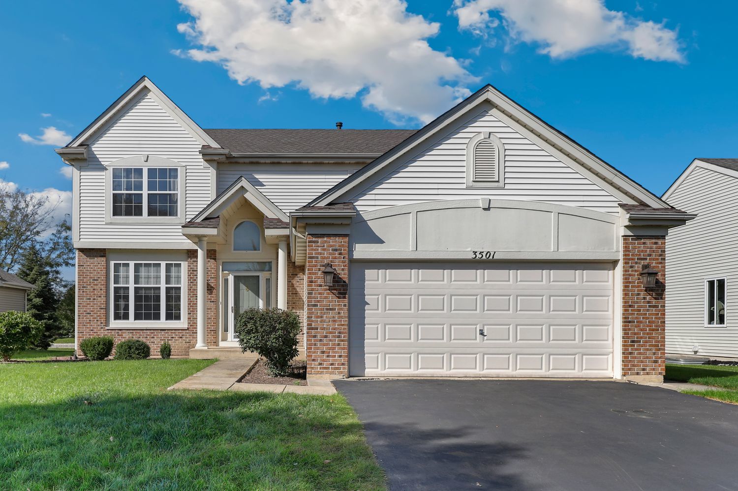 3501 Mustang Road Joliet, IL 60435 - Photo 1 of 35 a front view of a house with a yard and garage