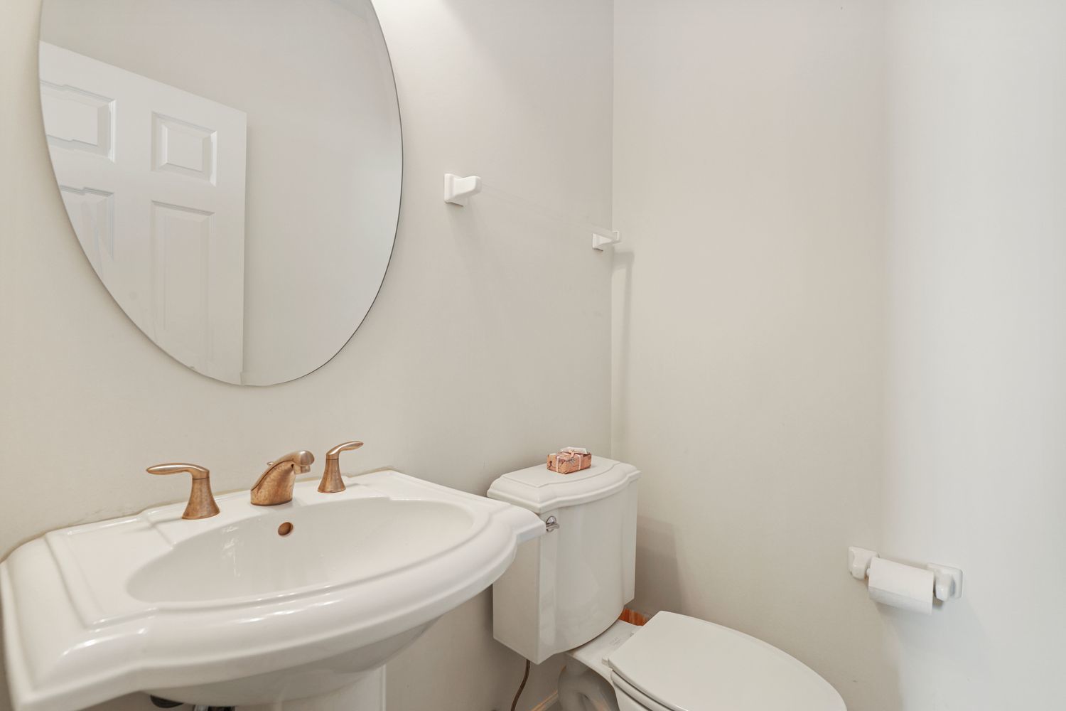 3501 Mustang Road Joliet, IL 60435 - Photo 11 of 35 a white toilet sitting next to a bathroom sink