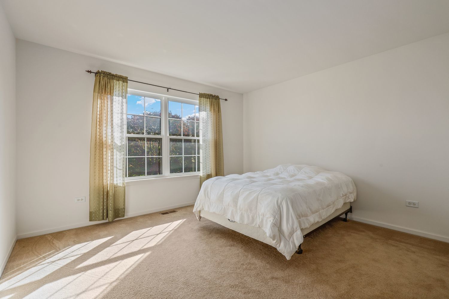3501 Mustang Road Joliet, IL 60435 - Photo 18 of 35 a bed sitting in a room next to a window