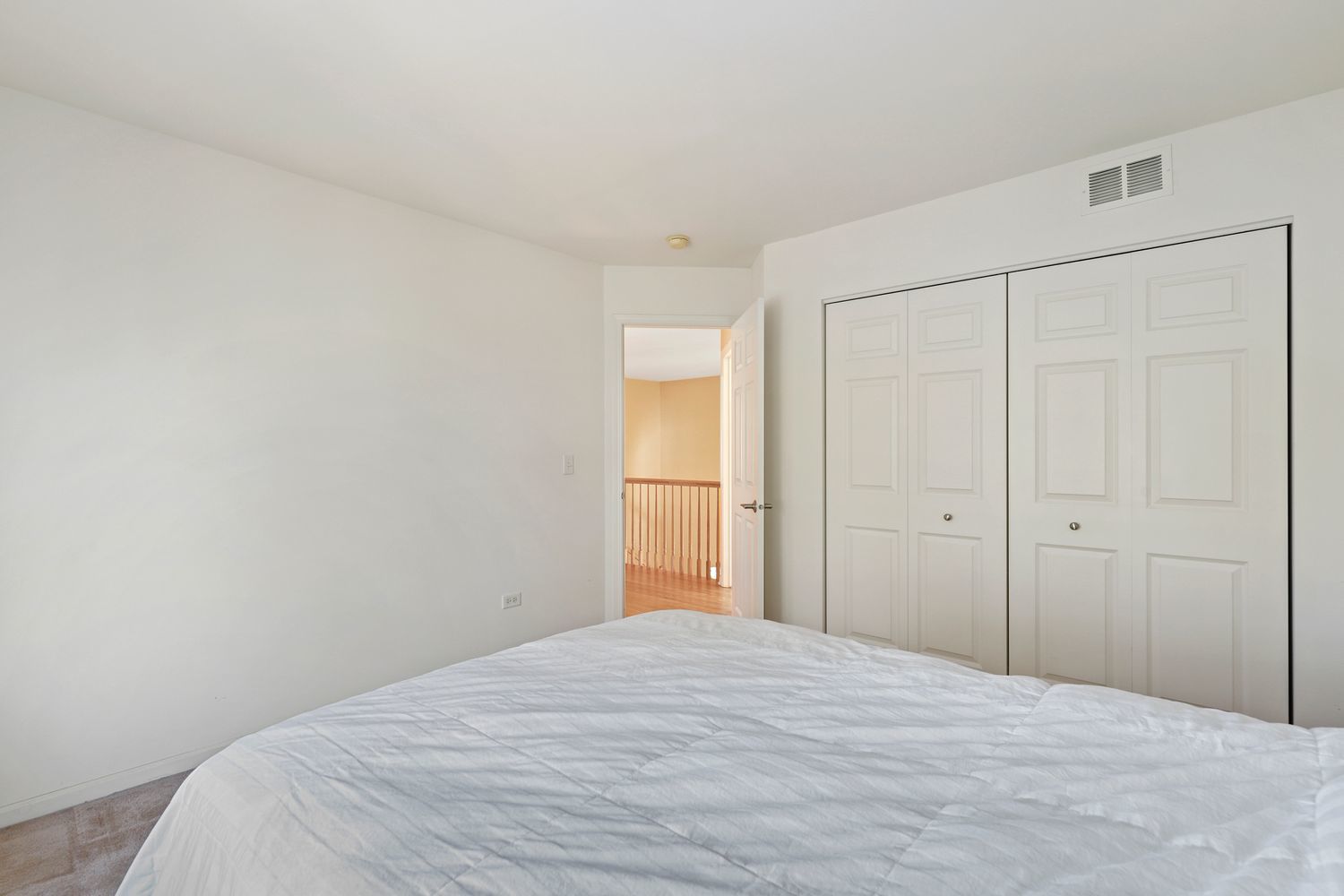 3501 Mustang Road Joliet, IL 60435 - Photo 19 of 35 a bedroom with a bed and wooden floor