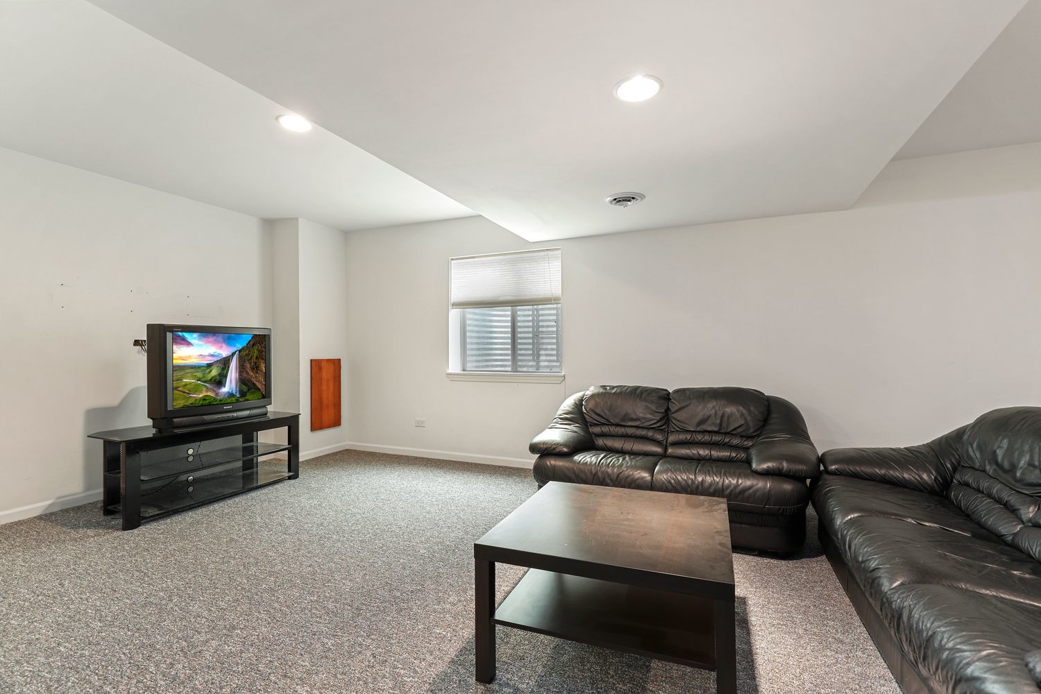3501 Mustang Road Joliet, IL 60435 - Photo 23 of 35 a living room with furniture and a flat screen tv
