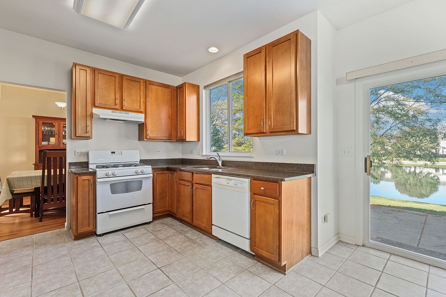 3501 Mustang Road Joliet, IL 60435 - Photo 4 of 35 a kitchen with stainless steel appliances granite countertop a stove a sink and a refrigerator