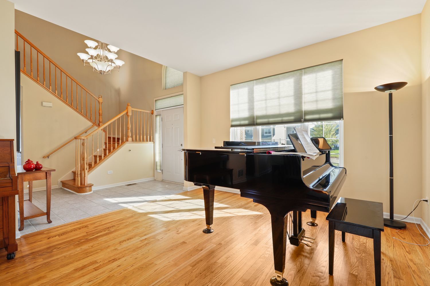 3501 Mustang Road Joliet, IL 60435 - Photo 9 of 35 a view of a livingroom with furniture staircase and a chandelier