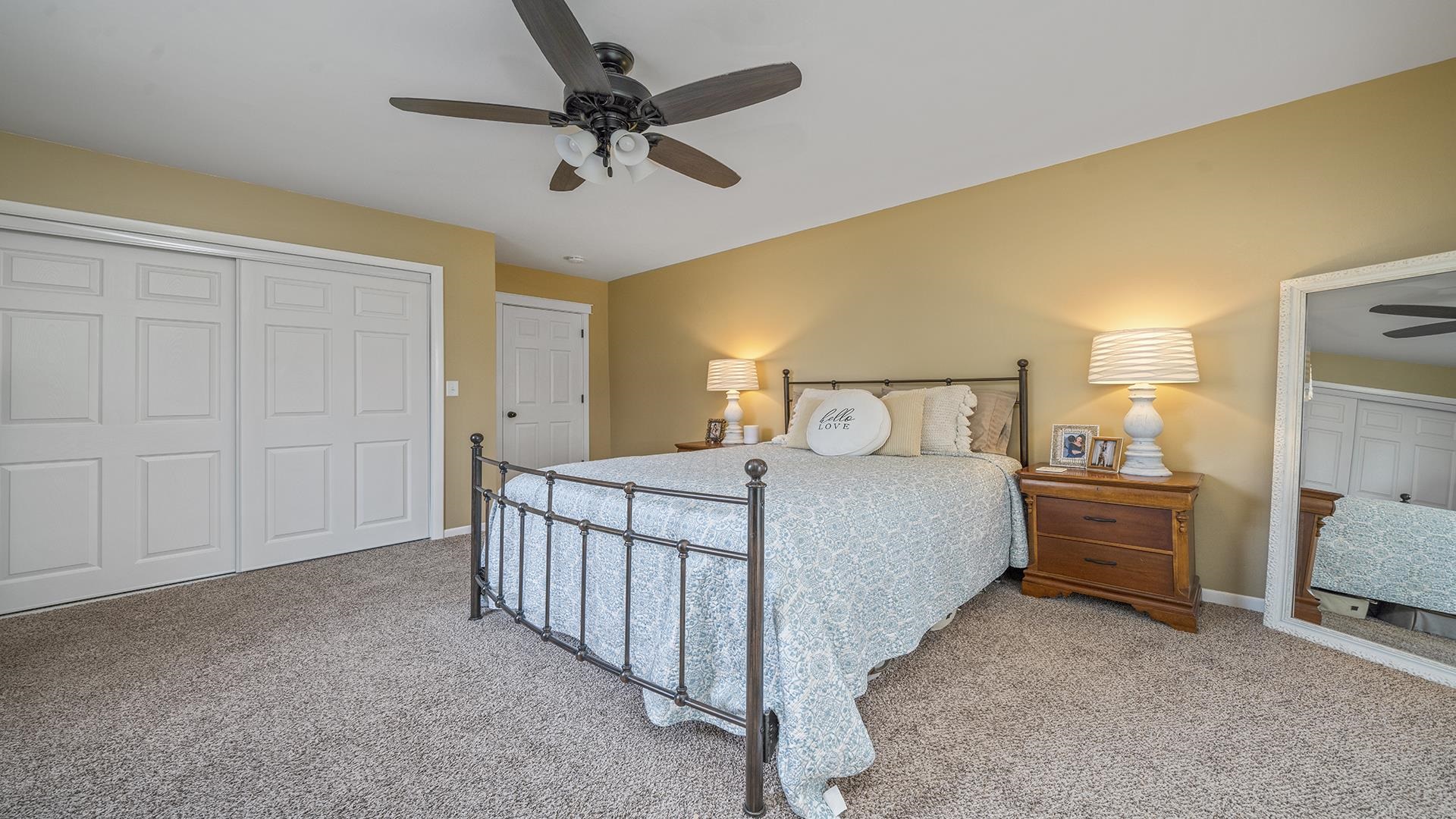 211 North Shabbona Road Shabbona, IL 60550 - Photo 11 of 33 a bedroom with a bed and a chandelier