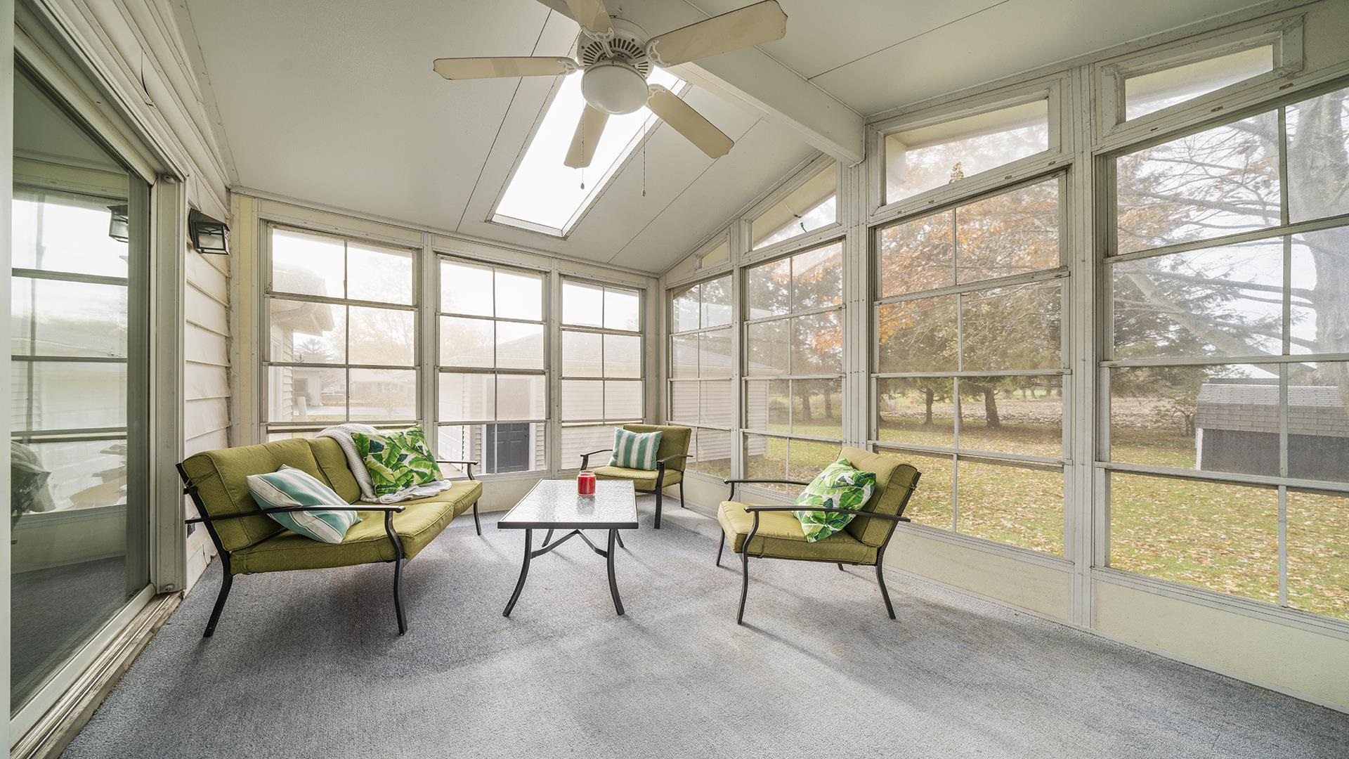 211 North Shabbona Road Shabbona, IL 60550 - Photo 25 of 33 a living room with furniture and a large window