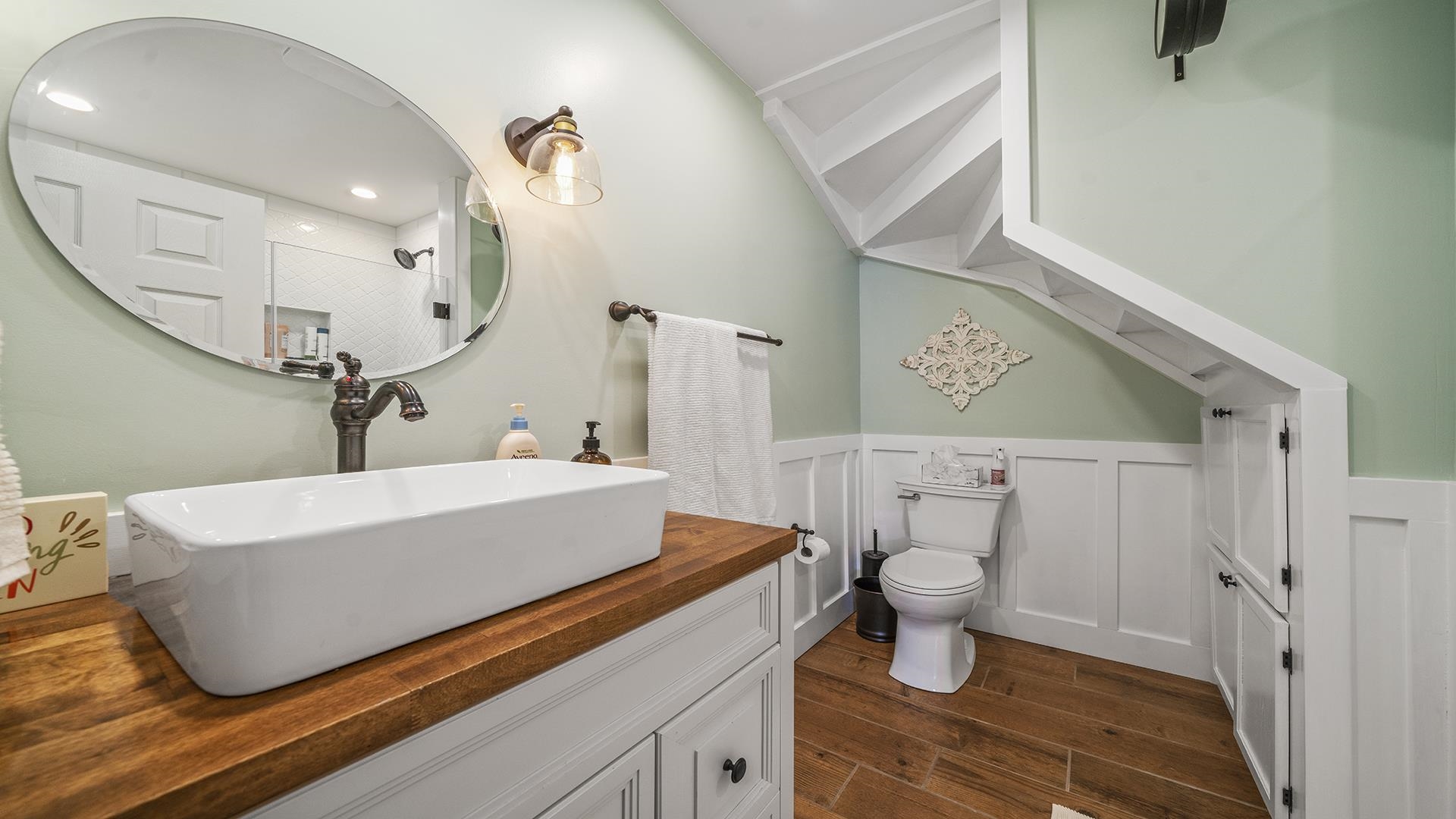 211 North Shabbona Road Shabbona, IL 60550 - Photo 9 of 33 a bathroom with a sink a toilet and a mirror
