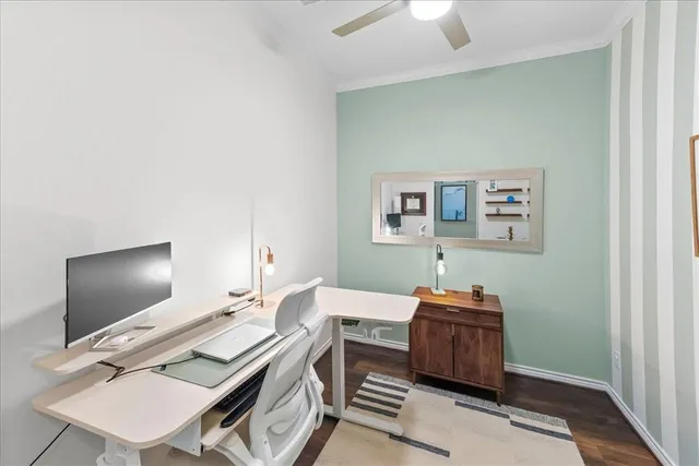 a bedroom with a bed and a potted plant