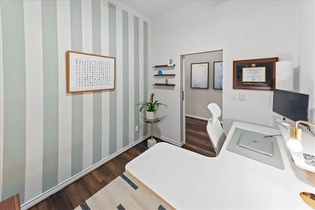 a bedroom with a bed couch and a window