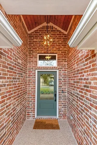 a view of gallery with wooden floor
