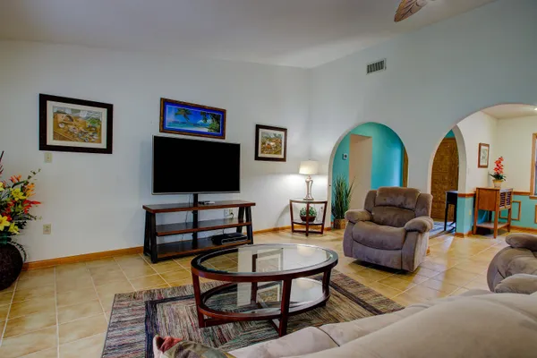 a living room with furniture and a flat screen tv