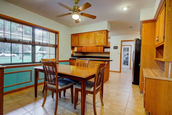 a dining room with furniture and window