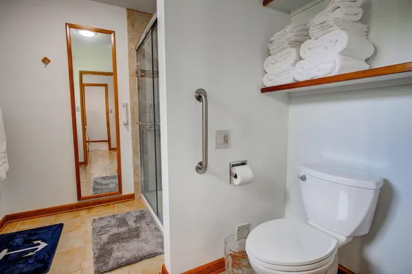a white toilet sitting next to a bathroom sink