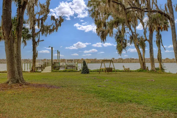 a balcony with table and chairs