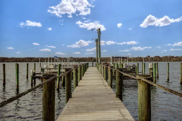 a balcony with table and chairs