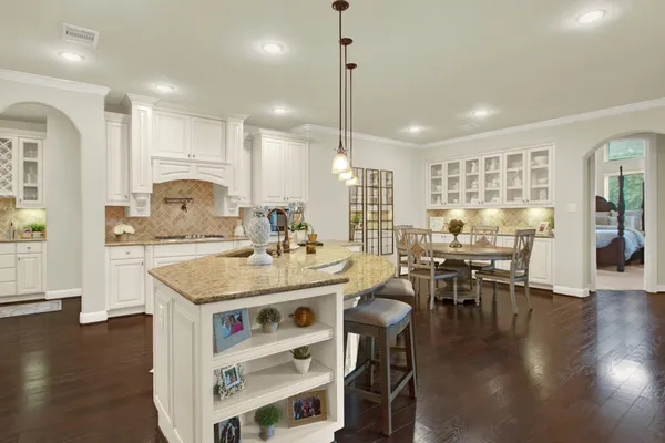 a kitchen with counter space and breakfast area