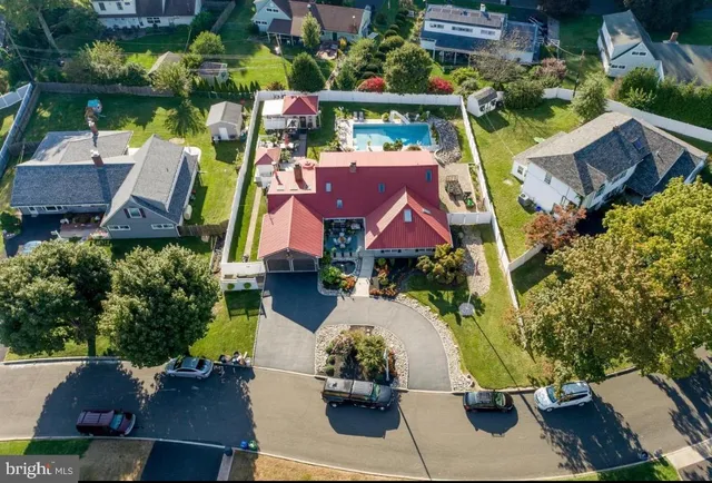 an aerial view of houses with yard