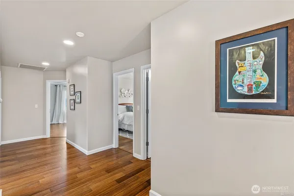 a view of an empty room and wooden floor