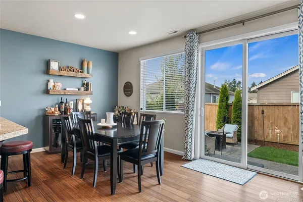 a view of a dining room with furniture window and outside view