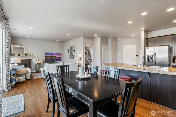 a view of a dining room with furniture and wooden floor
