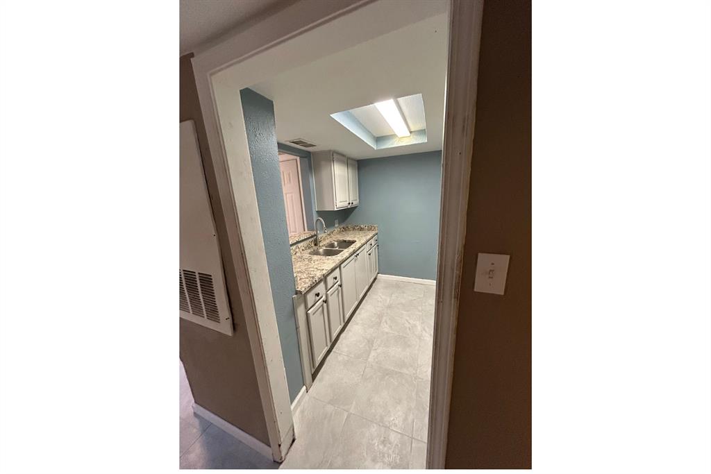 8001 Rothington Road, Unit 3137 Dallas, TX 75227 - Photo 13 of 38 a picture of a very nice looking hallway