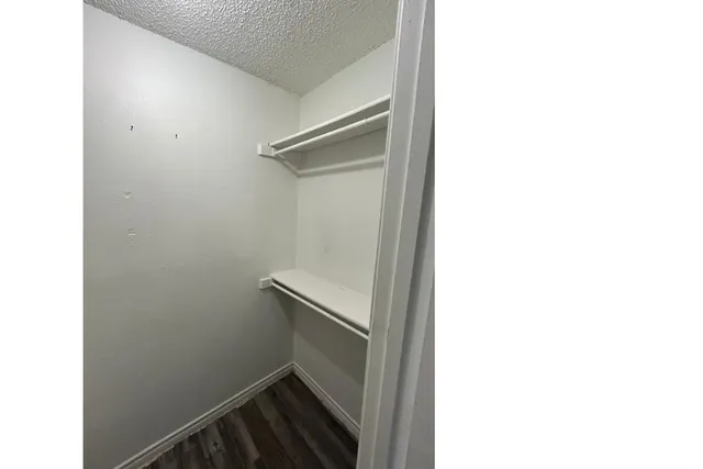 a view of entryway with window and wooden floor